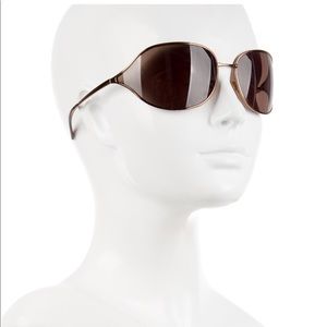 Brown Prada sunglasses with tinted lenses and Case